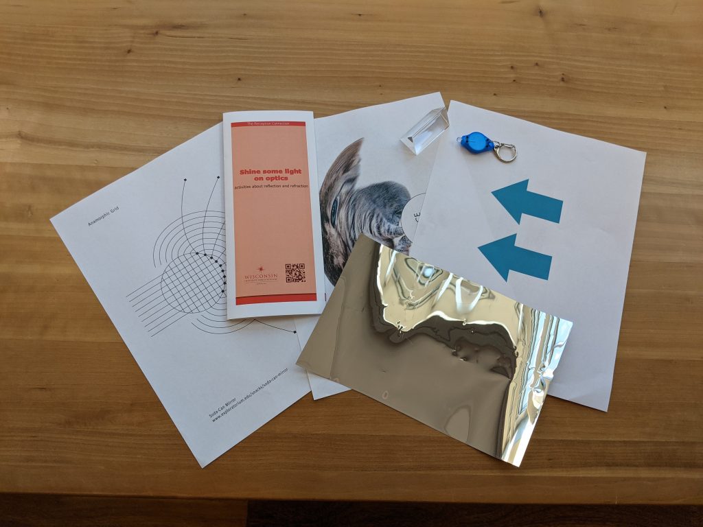 Materials to learn about reflection and refraction. worksheets and shiny paper