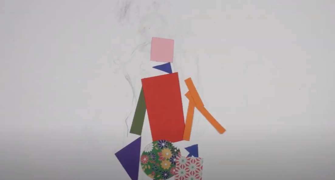 Screen shot of the how are you feeling movie. a human being made of scraps of paper.