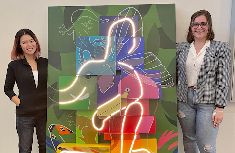 Sharon Tang and Kat Hubert in front of the art installation